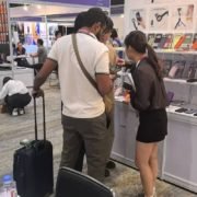 Sales team introducing custom mobile accessories and phone cases to a buyer