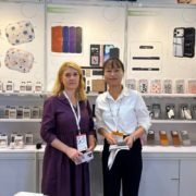 International customer visiting our custom phone case manufacturing booth at Global Sources