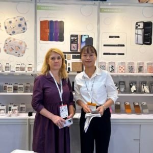 LM-global-sources-phone-case-manufacturer-client-photo-1.jpg International customer visiting our custom phone case manufacturing booth at Global Sources